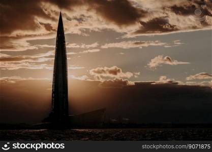 06/22/2018 Russia St. Petersburg. Glass skyscraper against cloudy sky and sunset. Lakhta Center in Saint Peterburg. Dark colours. Horizontal view. Peaceful atmosphere