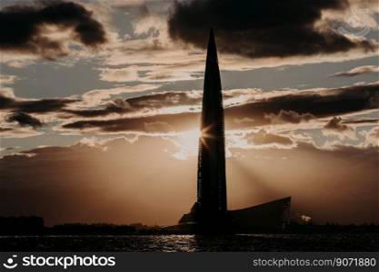 06/22/2018 Russia St. Petersburg. Saint Petersburg skyscraper in Lakhta against cloudy dark evening sky with sunset. Shore of Gulf of Finland. Business center