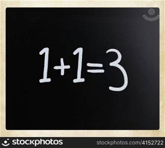 ""1+1=3" handwritten with white chalk on a blackboard"