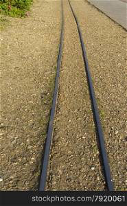 10.25 inch gauge miniature railway railroad, across gravel. Poole Park, Dorset, England United Kingdom.