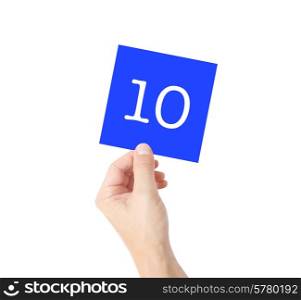 10 written on a card held by a hand