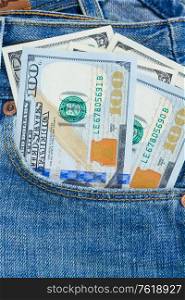 100 dollar bills in pocket of blue jeans. dollar money in pocket