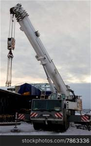 100 ton crane at the construction of the bridge. The extreme north. The polar night