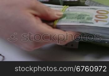 10000 dollars packs folded in cash collection bag and sealed