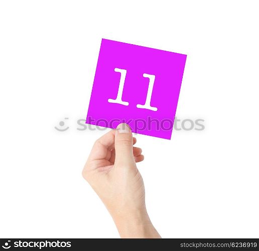11 written on a card held by a hand