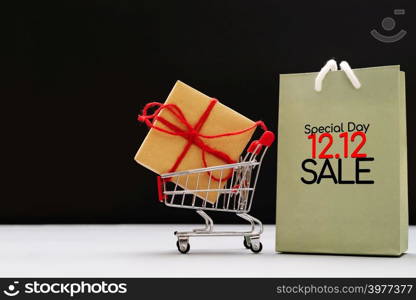 12.12 sale concept, shopping cart and shopping bags with gift box