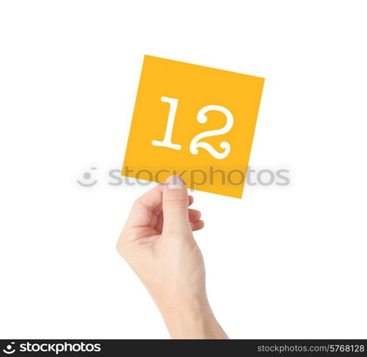 12 written on a card held by a hand