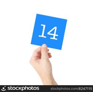 14 written on a card held by a hand