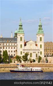 14th century Inner City Parish Church and Danube river in Budapest, Hungary.