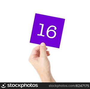 16 written on a card held by a hand