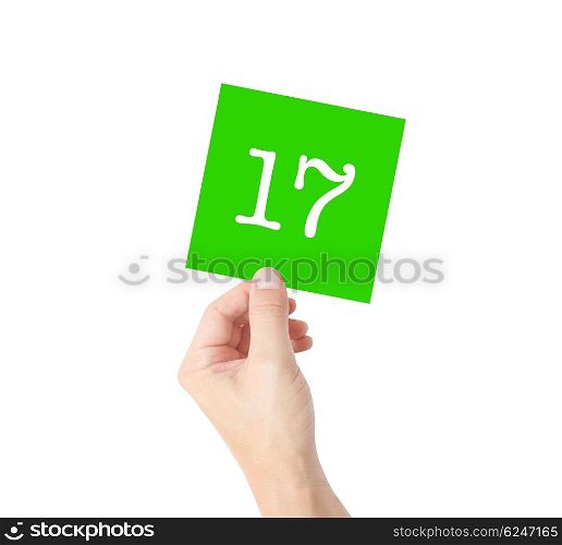 17 written on a card held by a hand