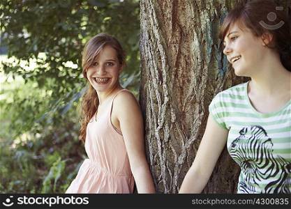 2 girls having fun together in a park