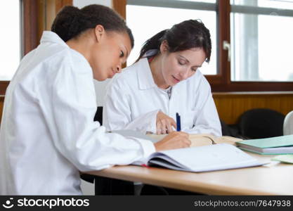 2 students of the medical university working hard