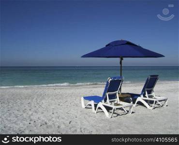 2 sun loungers on the beach