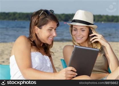 2 women connected on the beach