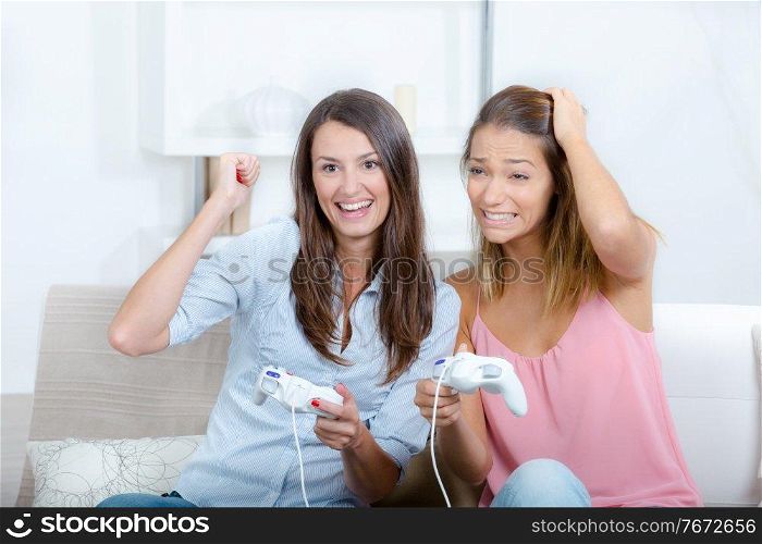 2 women playing video games
