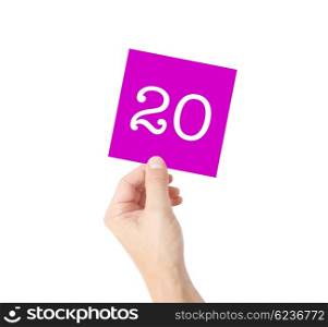 20 written on a card held by a hand
