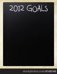 ""2012 goals" handwritten with white chalk on a blackboard"