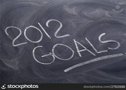 2012 goals - white chalk handwriting on blackboard with eraser patterns