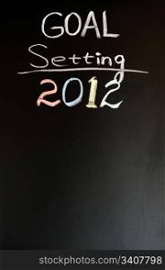 2012 New year goals written with chalk on a blackboard