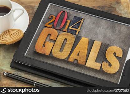 2014 goals - New Year resolution concept - text in vintage letterpress wood type on a digital tablet screen