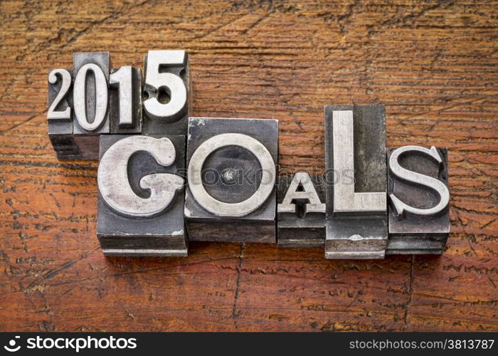 2015 goals - New Year resolution concept - text in vintage metal type blocks against grunge wood