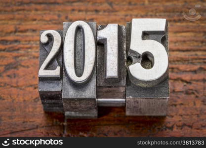 2015 - New Year concept - text in vintage metal type over gungre wood