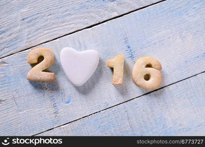 2016 homemade cookies on wooden table in the kitchen