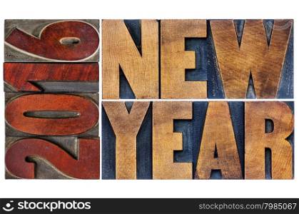 2016 New Year - greeting card or banner - isolated word abstract in letterpress wood type printing blocks stained by color inks