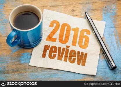 2016 review text on a napkin with a cup of coffee