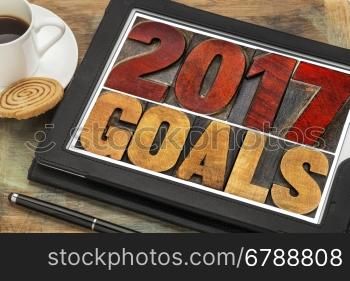 2017 goals banner - New Year resolution concept - text in vintage letterpress wood type printing blocks on a digital tablet with a cup of coffee