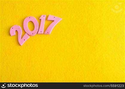 2017 in pink numbers isolated against a yellow background