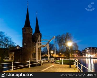 2017, march 25. Eastern Gate in Delft at night. The Eastern Gate Delft, consists of a land gate and a water gate that are connected by remains of a city wall.