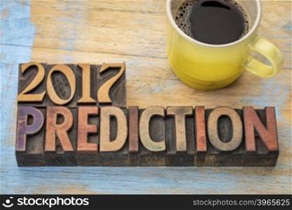 2017 prediction concept - text in vintage letterpress wood type printing blocks with a cup of coffee
