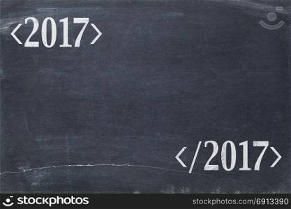 2017 year concept - copy space ob blackboard enclosed by programming syntax tags