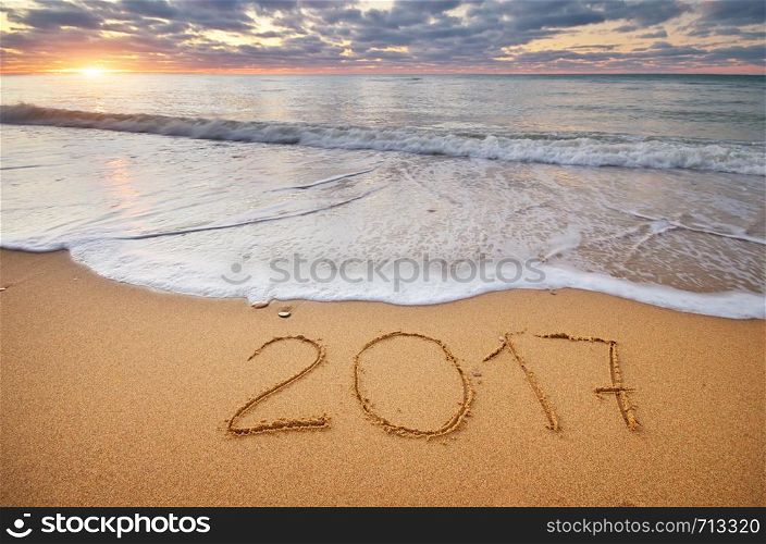 2017 year on the sea sand shore. Element of design.