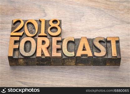 2018 forecast word abstract in vintage letterpress wood type against grained wood