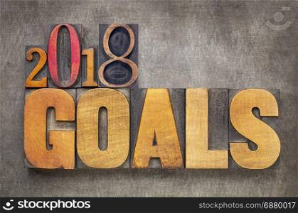 2018 goals - New Year resolution concept - word abstract in vintage letterpress wood type blocks against grunge metal background