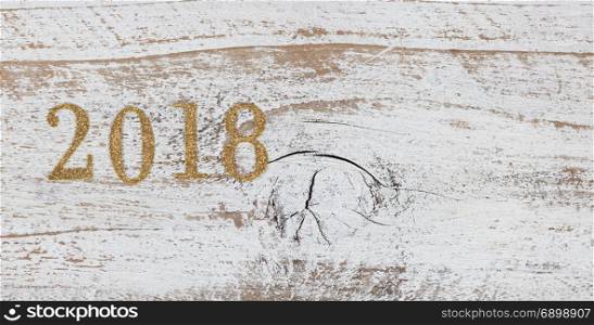 2018 gold numbers on rustic white wood
