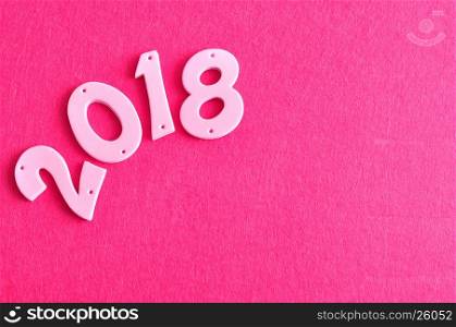 2018 in pink numbers isolated against a pink background