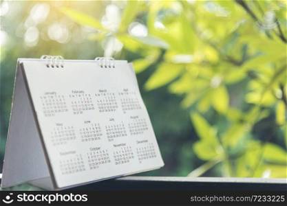 2019 Calendar Event Planner. Close up on calendar on desk with bokeh and sun light as a background with copy space. Schedule using calendar set timetable on organize schedule. Timeline Concept.
