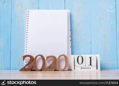 2020 Happy New Year with blank notebook and wooden number. time for a New Start, Resolution, goal, Plan, Action and Mission Concept