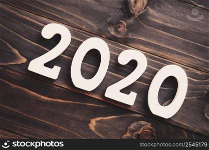 2020 New year concept : 2020 wood number on table background.