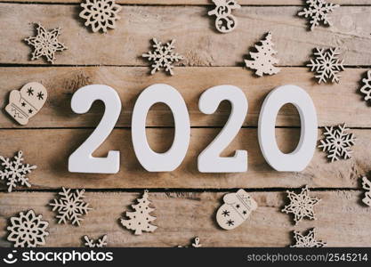 2020 New year concept on wood table and christmas decoration background.