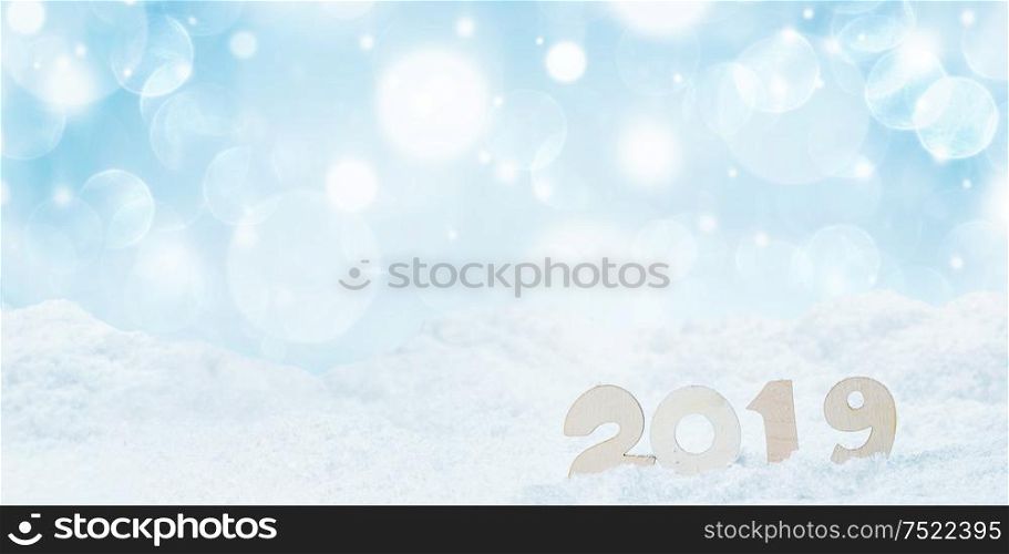 2020 New Year in snow design concept. Wooden 2020 New Year horizontal template with blue and white bokeh backgound. 2019 New Year in snow