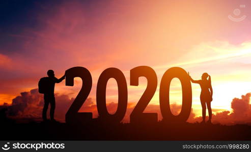 2020 Newyear Couple tries to push number of 2020 Happy new year concept