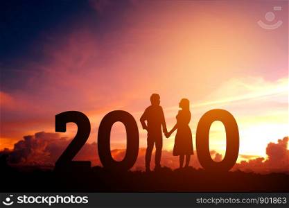 2020 Newyear Silhouette young couple Happy for romantic new year concept.