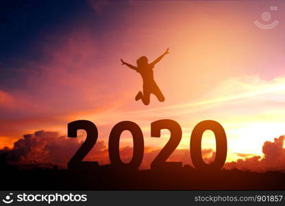 2020 Newyear Silhouette young woman jumping to Happy new year concept.