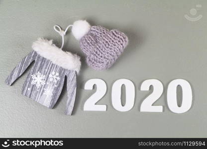 2020, sweater in wood and hat in wool