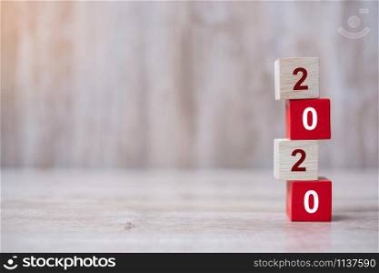 2020 wooden Blocks arrange on table background. Business, Risk Management, Resolution, strategy, goal, New Year New You and happy holiday concepts